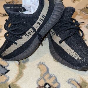 Yeezy Black and Cream Athletic Shoes